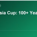 Historic football trophy and packed Malaysian stadium, illustrating the century-long history of the Malaysia Cup